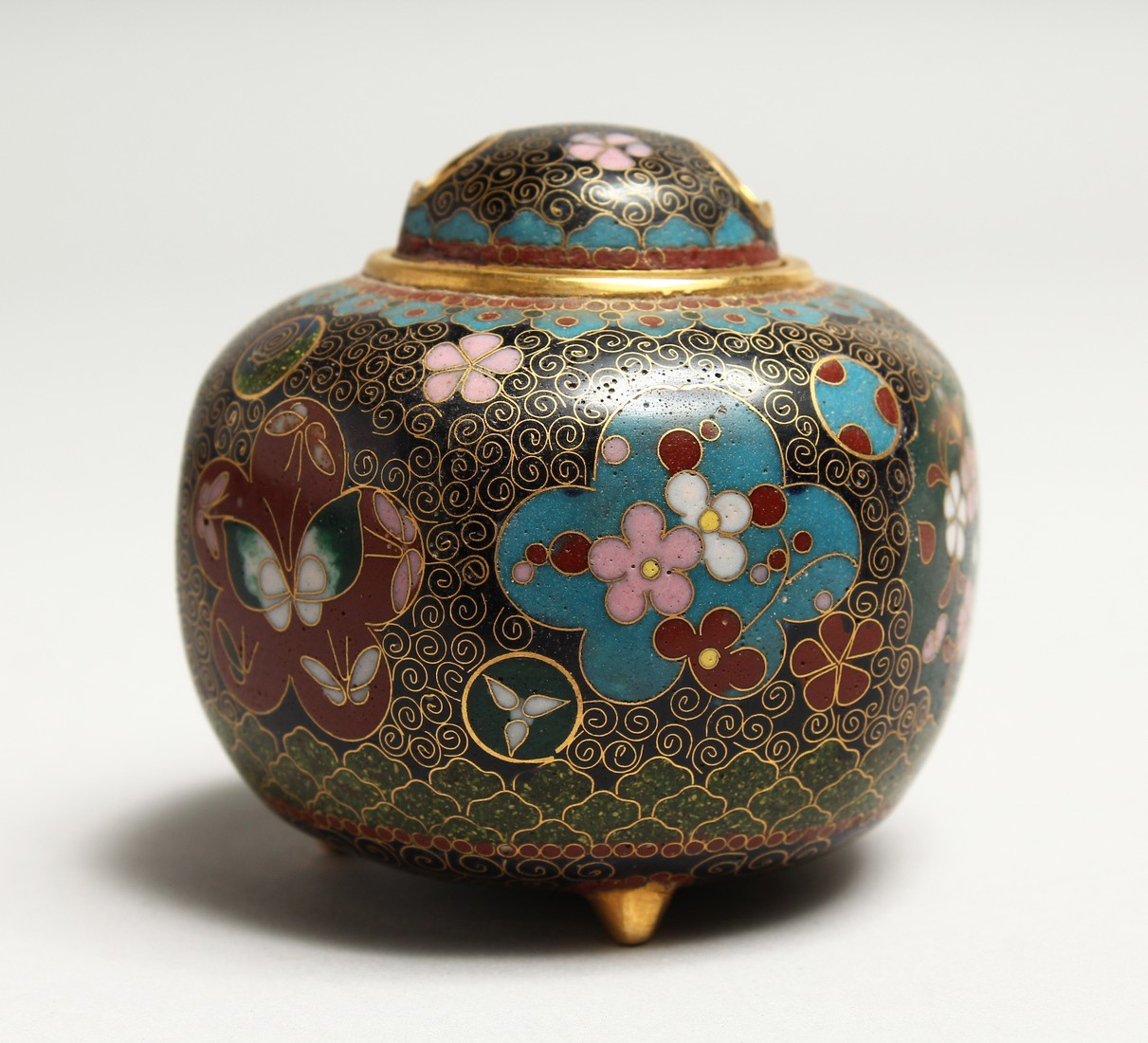A JAPANESE CLOISSONE ENAMEL CENSER with panels of flowers and butterflies 3ins high