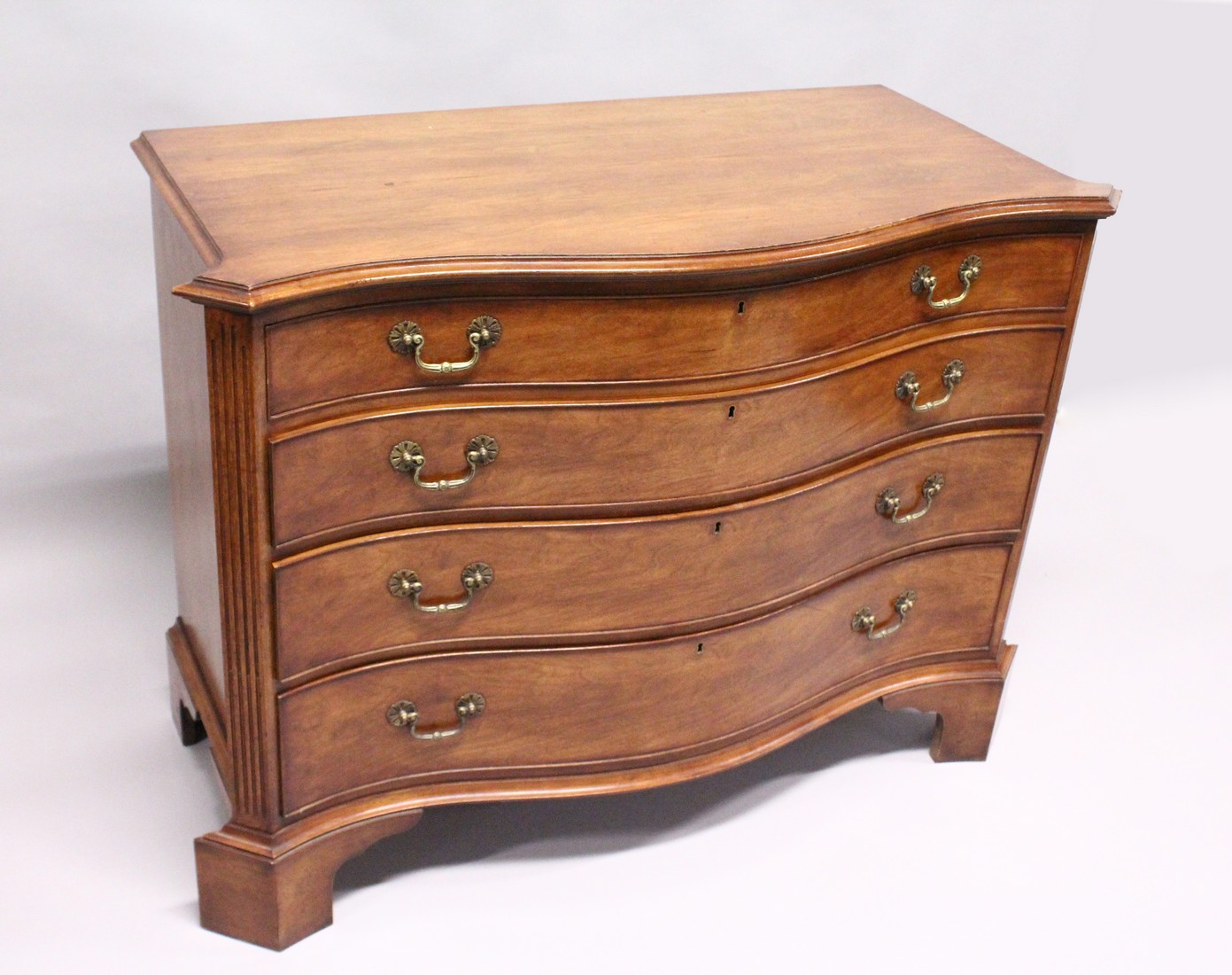 A GEORGE III DESIGN SERPENTINE FRONTED MAHOGANY COMMODE with four graduated long drawers, fluted - Image 2 of 6