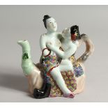 A SMALL CHINESE PORCELAIN EROTIC TEA POT 5.5ins high.