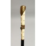 A WALKING CANE WITH GILT HANDLE 33ins long
