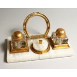 A GILT METAL AND WHITE ONYX EQUESTRIAN THEME DESK STAND 10.75 INS LONG