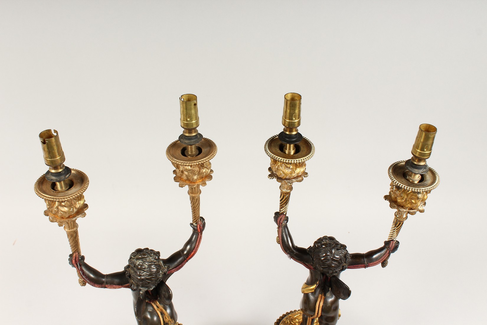 AS VERY GOOD PAIR OF REGENCY BRONZE AND ORMOLU TWO BRANCHED CHERUB CANDLESTICK each holding - Image 5 of 6