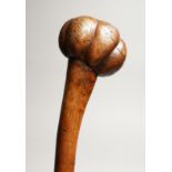 A GOOD TRIBAL WOODEN CLUB 31ins long.