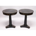 A PAIR OF BLACK LACQUER CIRCULAR PEDESTAL TABLES, 20th Century, the tops frieze and tricorn base
