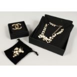 THREE DECORATIVE PIECES AFTER CHANEL, brooch, necklace, and bracelet.