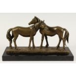 A BRONZE GROUP OF TWO HORSES, “THE ACCOLADE”, on a marble base. 14ins long