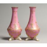 A SMALL PAIR OF SEVRES PINK PORCELAIN VASES, gilt and seed pearl decoration, on three hoof feet.