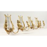 A VERY GOOD SET OF FOUR FRENCH ORMOLU, LYRE, TWO LIGHT WALL SCONCES with acanthus and anthemis.