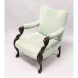 A GOOD, POSSIBLY IRISH, MAHOGANY ARM CHAIR with padded back arms and seat. The frame carved with