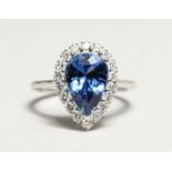 A GOOD 18CT WHITE GOLD, SAPPHIRE AND DIAMOND RING, the pear shape sapphire approx. 4ct, the