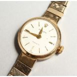 A LADIES 9CT GOLD ROLEX WRISTWATCH