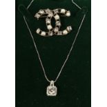 A CHANEL REPLICA BROOCH AND NECKLACE
