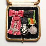 THREE MINIATURE MEDALS in a spinks case.