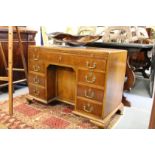 A GEORGE III MAHOGANY KNEEHOLE DESK with plain top and brushing side, long drawer over a kneehole