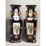 A LARGE PAIR OF IRONSTONE JAPAN PATTERN TWO HANDLED VASES with Chinese panels. 23ins high.
