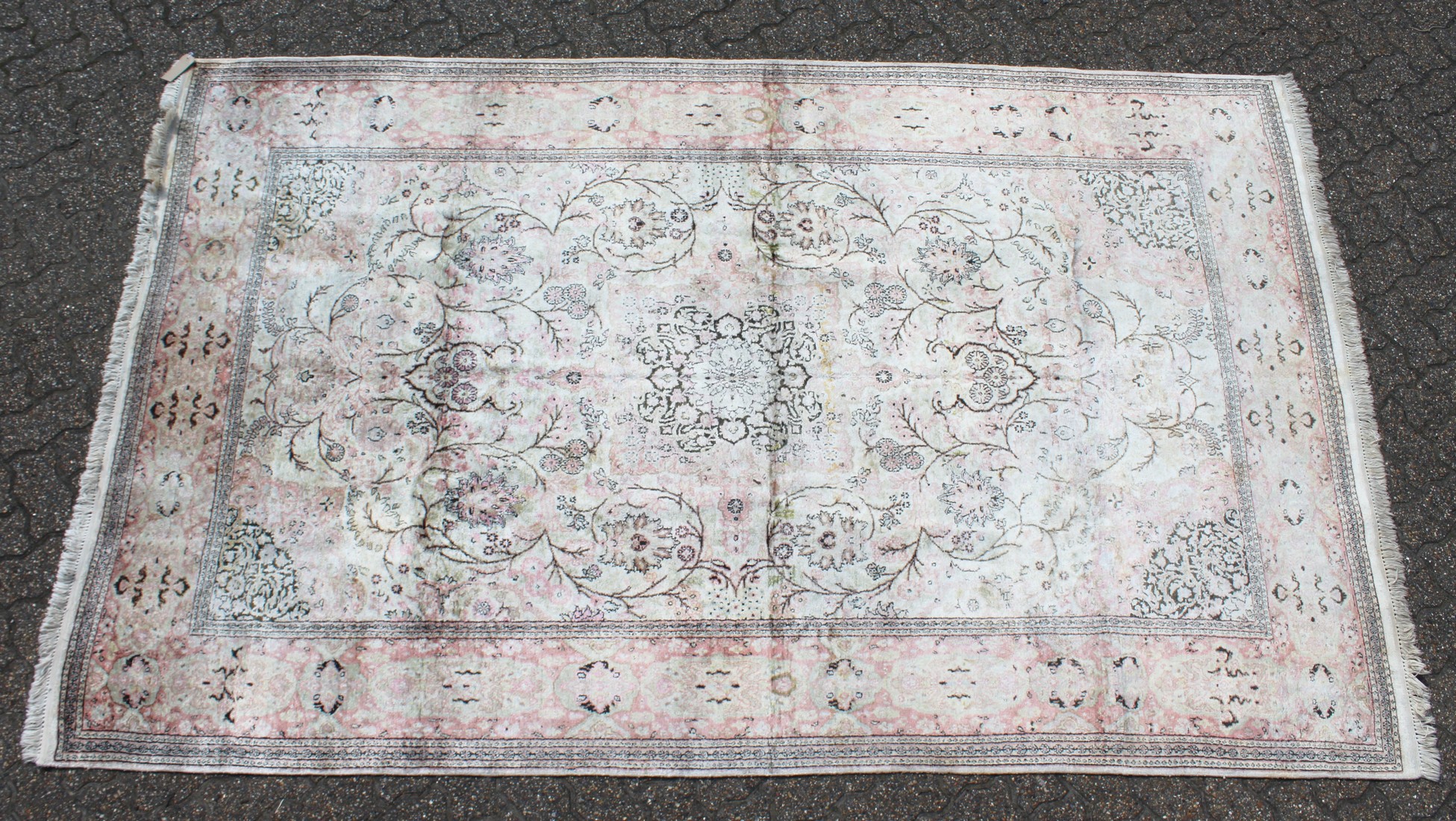 A MID 20TH CENTURY PERSIAN SILK KASHMIR CARPET, pale cream ground with typical floral decoration.