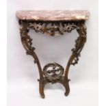 AN 18TH /19TH ITALIAN ROUGE MARBLE AND CARVED OAK CONSOLE TABLE, of serpentine outline, the top