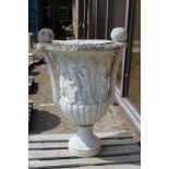 A VERY GOOD, PAIR OF ITALIAN CARVED, WHITE MARBLE TWO HANDLED URNS, the sides carved with cupids 4ft