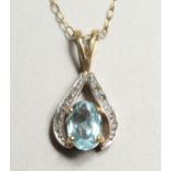 A GOLD AND AQUAMARINE PENDANT AND CHAIN