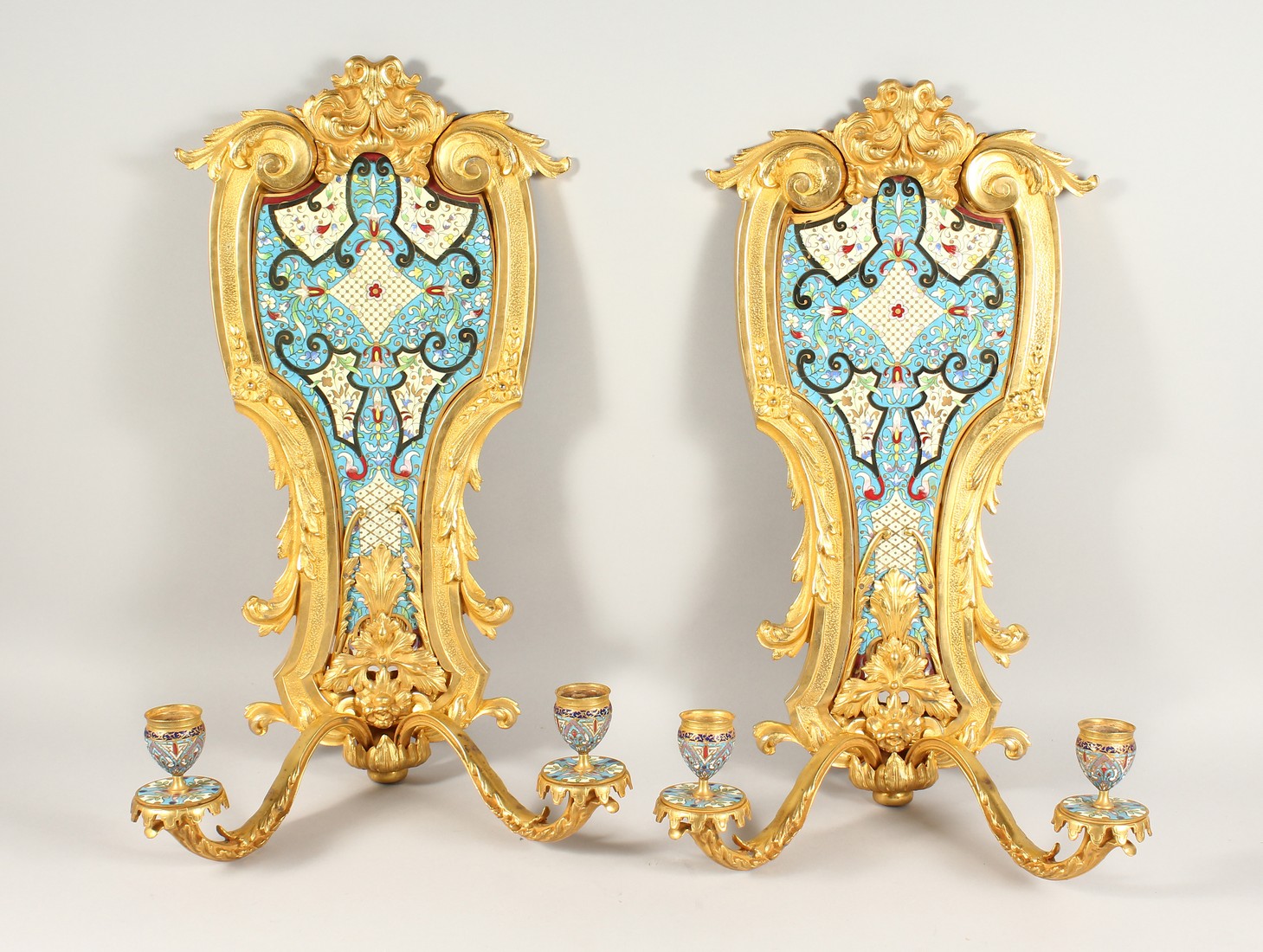A SUPERB PAIR OF FRENCH ORMOLU AND ENAMEL TWO LIGHT WALL SCONCES WITH ACANTHUS AND SCROLLS 22ins