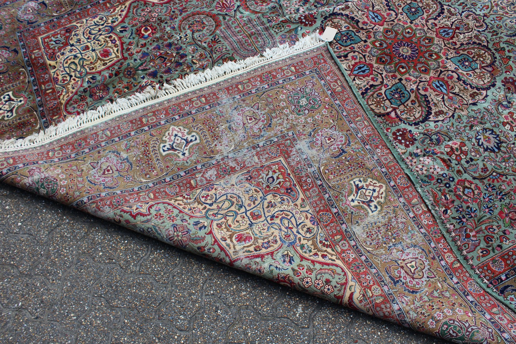 A LARGE PERSIAN TABRIZ CARPET, pale green ground with all over stylised floral decoration within a - Image 4 of 5