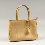 A DEBENHAMS BEIGE HANDBAG with dust cover.