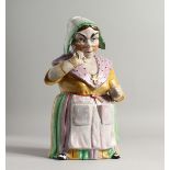 A CONTINENTAL PORCELAIN COOKIE JAR as a lady whose head and shoulders form the lid. 12ins high.