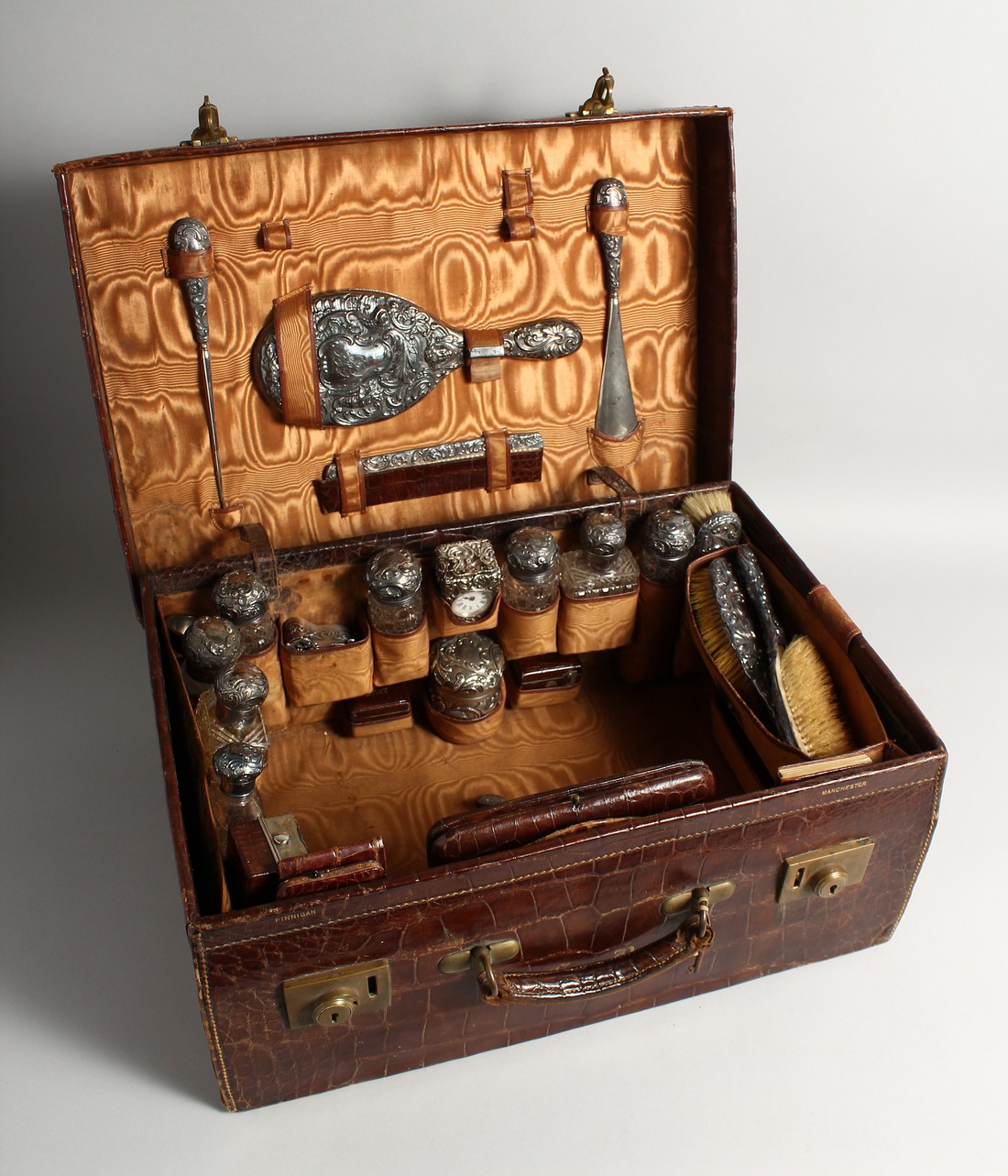 A VERY FINE VICTORIAN CROCODILE AND SILVER TRAVELLING CASE, filled with clock, nine silver top