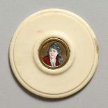 A VICTORIAN CIRCULAR IVORY PLAQUE with a portrait of a young girl 2ins diameter.