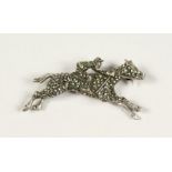 A MARCASITE JOCKEY BROOCH