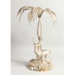 A VERY GOOD PLATED CENTREPIECE, a stag standing beneath a palm tree. 18ins high.