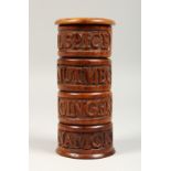 A FOUR TIER SPICE HOLDER, carved with acorns, allspice, nutmeg, ginger & lemon. 6.5ins high