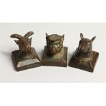 THREE SMALL JAPANESE BRONZE SEALS with animal heads 1.25ins long