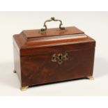 A GEORGE III MAHOGANY THREE DIVISION TEA CADDY with beaded top, brass carrying handles and