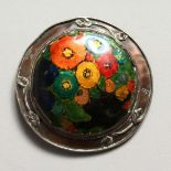 A SILVER AND ENAMEL CIRCULAR BUCKLE CONVERTED INTO A BROOCH.