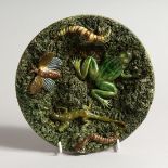 A PALISSY WARE TYPE CIRCULAR DISH, moulded decoration with a frog, lizard etc., impressed mark to