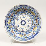 A MAJOLICA BLUE AND CREAM TIN GLAZED CIRCULAR DISH, 13ins diameter.