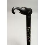 AN INLAID EBONY WALKING STICK, the handle as an elephant’s head 35ins long