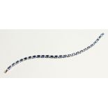 AN 18CT WHITE GOLD AND SAPPHIRE AND DIAMOND LINE BRACELET 17cm long