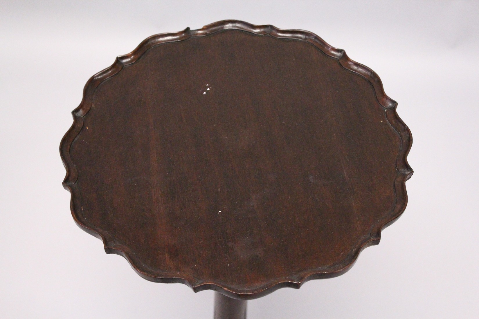 A GEORGE III DESIGN MAHOGANY TRIPOD TABLE, with pie-crust top, turned column on three carved legs - Image 2 of 6