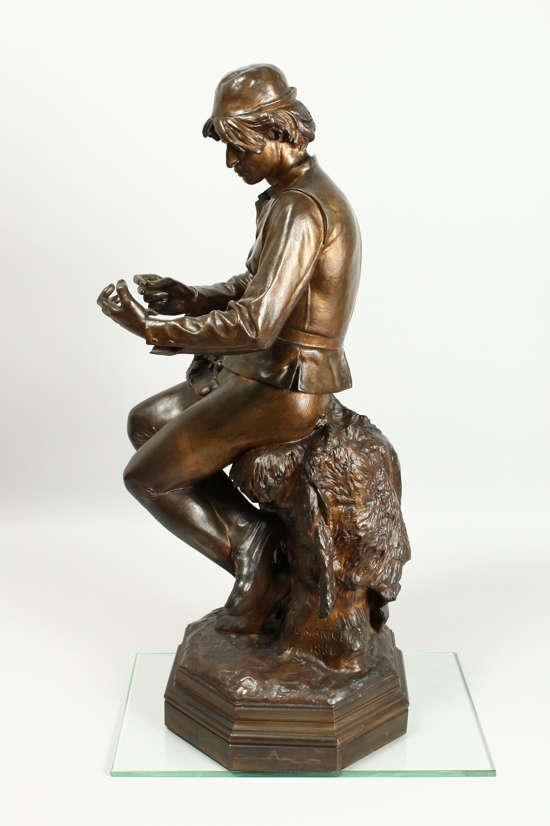 C. MANICLIER. A LARGE BRONZE OF A YOUNG MAN, seated on a tree stump with octagonal base. Signed - Image 12 of 18