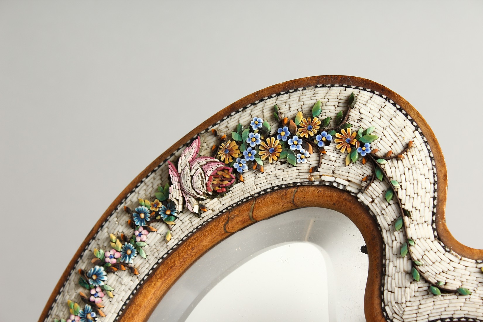 A GOOD MOSIAC FRAMED SHAPED EASEL MIRROR with a band of flowers 13.5ins high. - Image 2 of 8