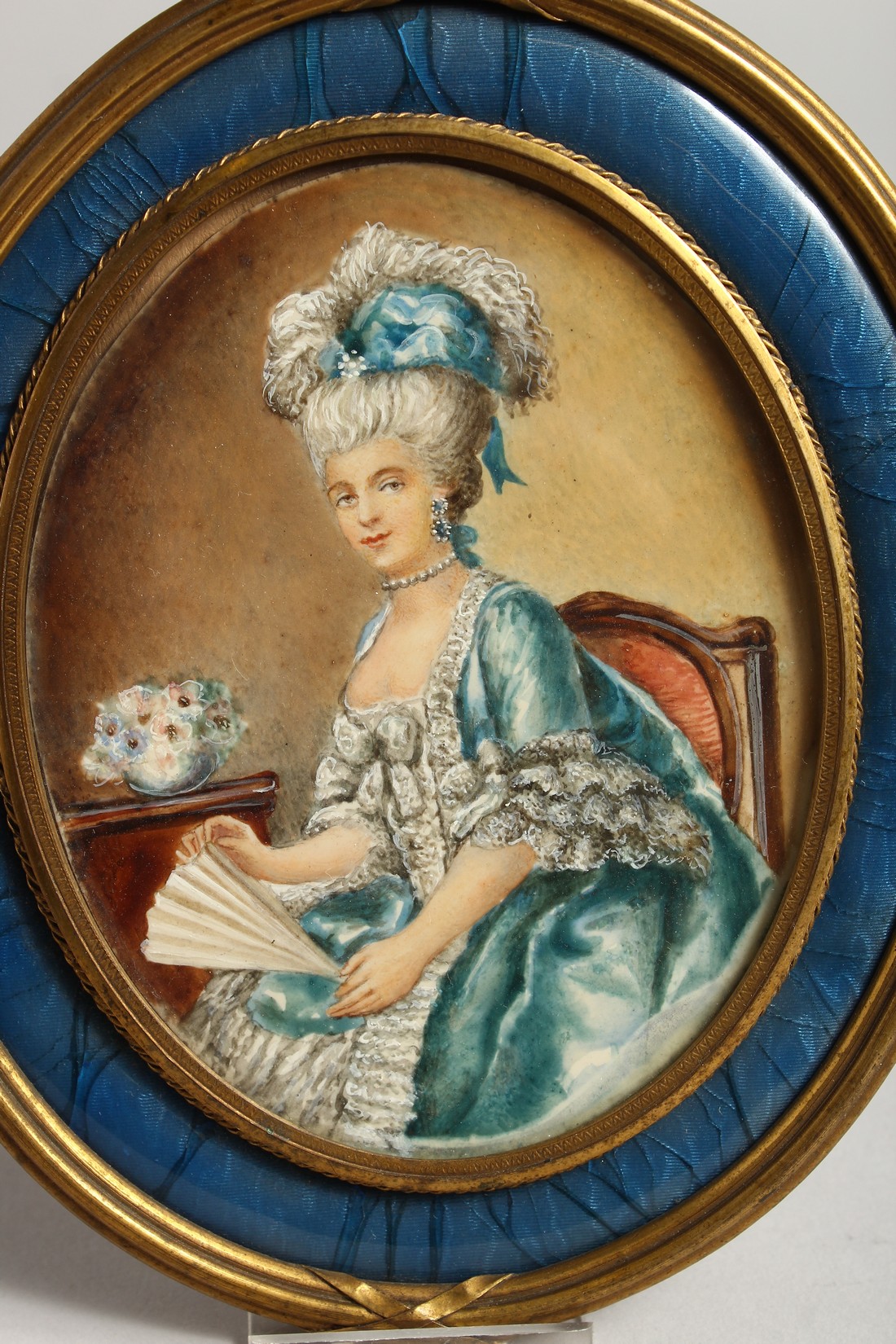 A VERY GOOD 19TH CENTURY FRENCH OVAL PORTRAIT OF A LADY holding a fan, in a blue enamel and ormolu - Image 2 of 4