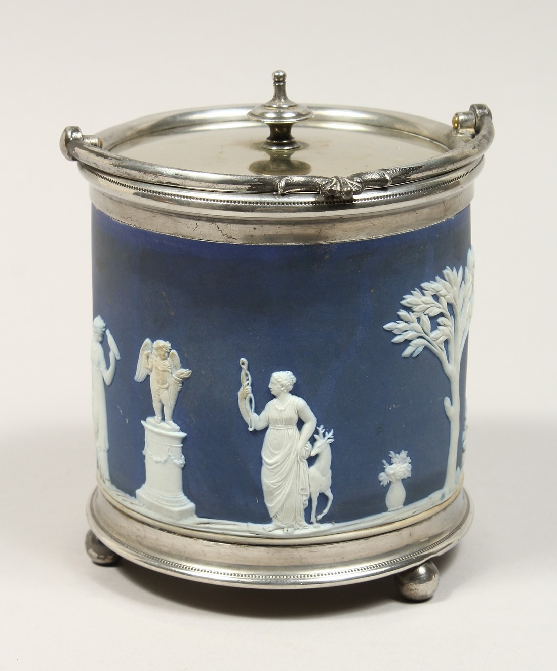 A WEDGWOOD BLUE AND WHITE JASPER WARE BISCUIT BARREL.