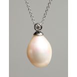 AN 18CT WHITE GOLD AND FRESHWATER PEARL PENDANT with fine chain. Pearl 13mm, chain 43cm long,