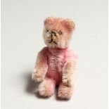 A MINIATURE PINK FUR ARTICULATED TEDDY BEAR 3.5ins high