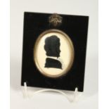 A LATE 9TH CENTURY SILHOUETTE PORTRAIT OF A LADY, framed oval, in an ebony frame. 5ins x 4.25ins.