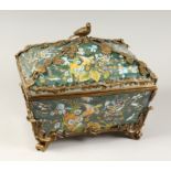 A LARGE CONTINENTAL STYLE PORCELAIN AND BRONZE MOUNTED CASKET, decorated with exotic flowers and