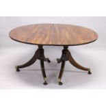 A GOOD GEORGIAN DESIGN MAHOGANY DOUBLE PILLAR DINING TABLE with loose leaf, on quadruple curving