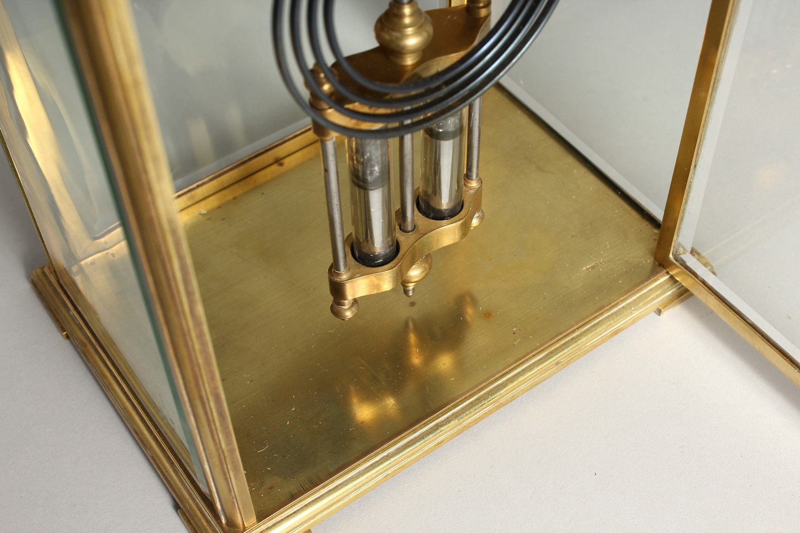 A GOOD BRASS FOUR GLASS CLOCK with white dial and pendulum. 12ins high. - Image 11 of 12